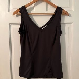 Wrinkle free tank to wear casually or dress up with jewelry.  Has raw edges.